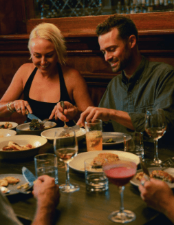 Friends sat at a dinner table